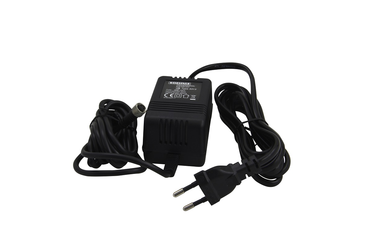 Black ‘ Soehnle ’ mains adaptor with a compact transformer unit and two cables: one with a black Euro plug (2 round metal pins), the other with a silver, round special plug. Original 230V mains adaptor for the Soehnle 7744 scales.